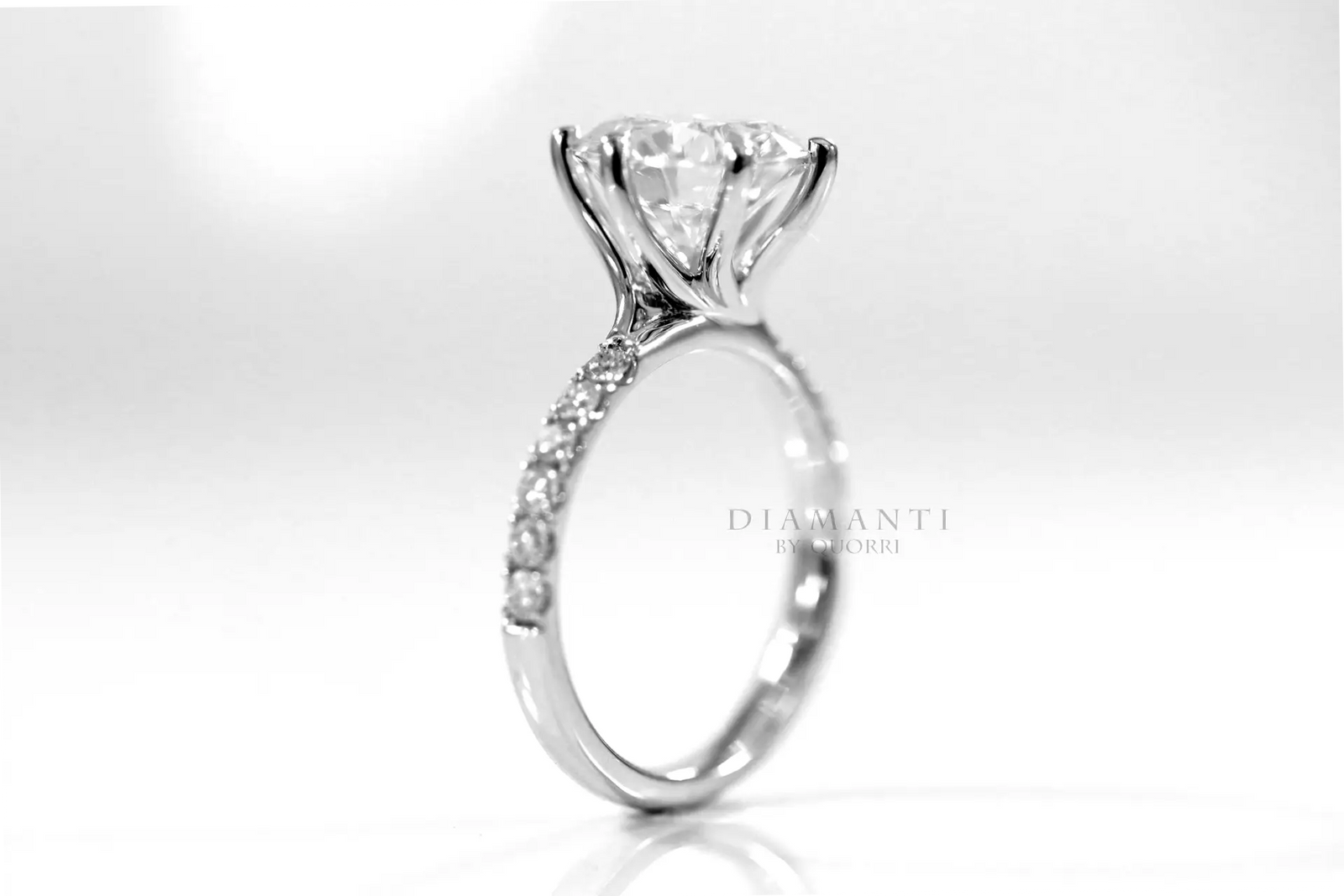 platinum affordable six prong round accented lab diamond engagement ring 