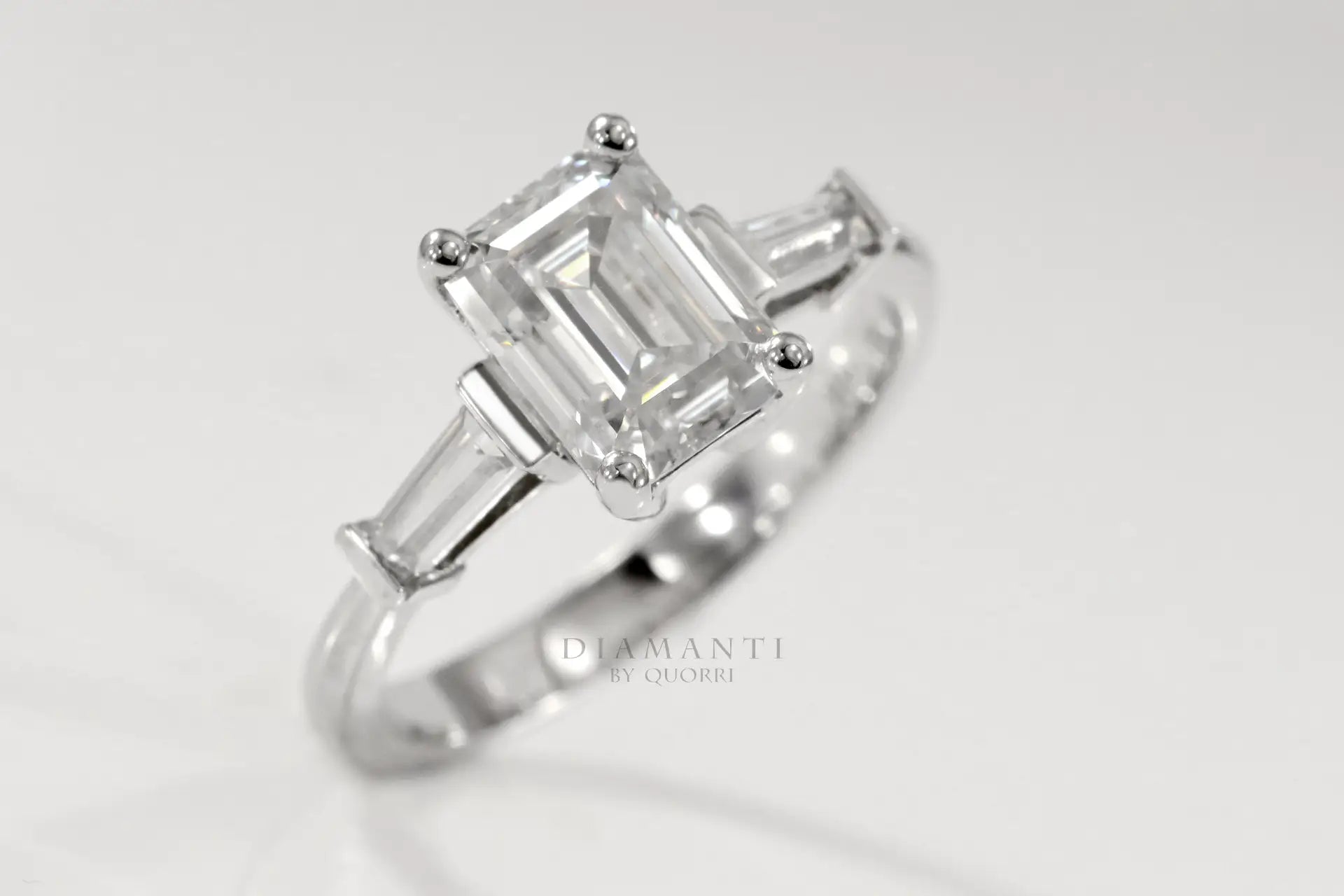 white gold 3 carat emerald and baguette three stone lab diamond engagement ring Quorri