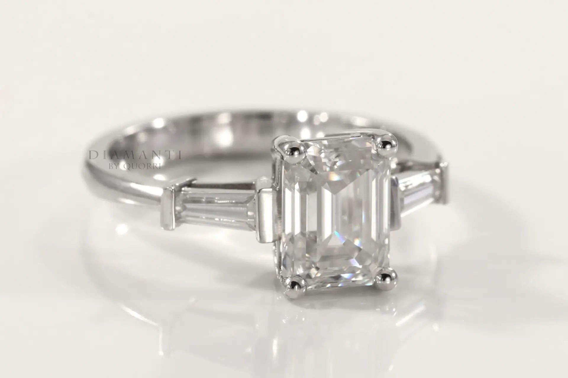 2 carat emerald and baguette three stone lab created diamond engagement ring Quorri Canada