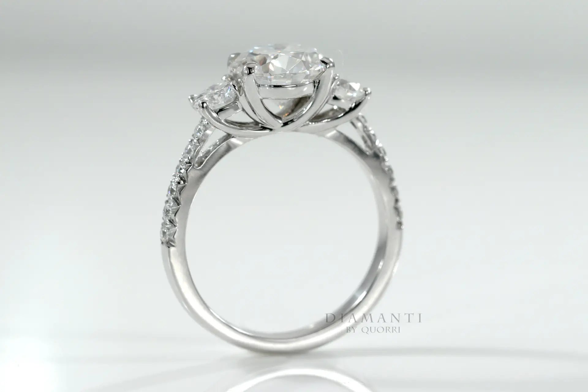 1.50 carat 18k white gold three stone round lab diamond engagement ring with accents Quorri