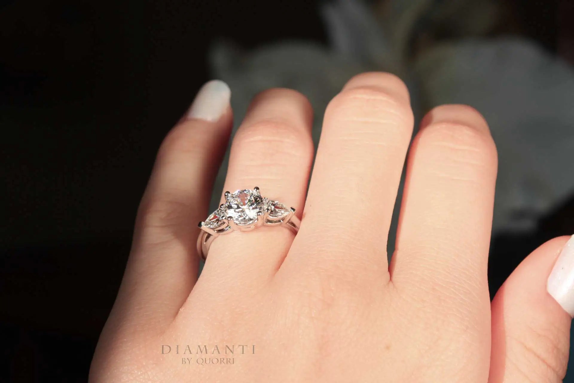 1.5 carat three stone round and pear accented lab grown diamond engagement ring