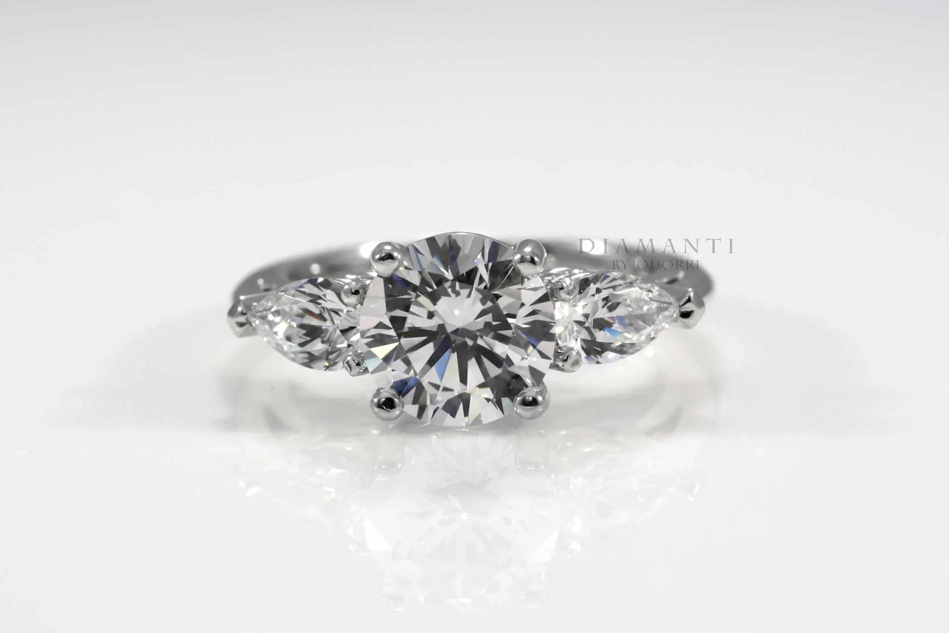 three stone round and pear accented lab diamond engagement ring