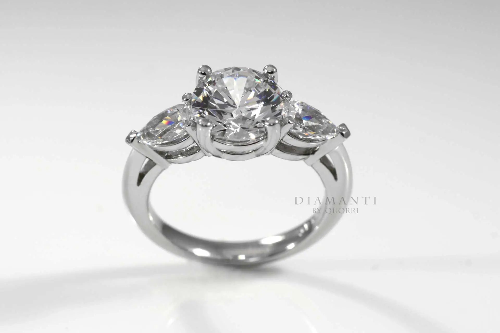 white gold three stone 2ct round and pear accented lab diamond engagement ring