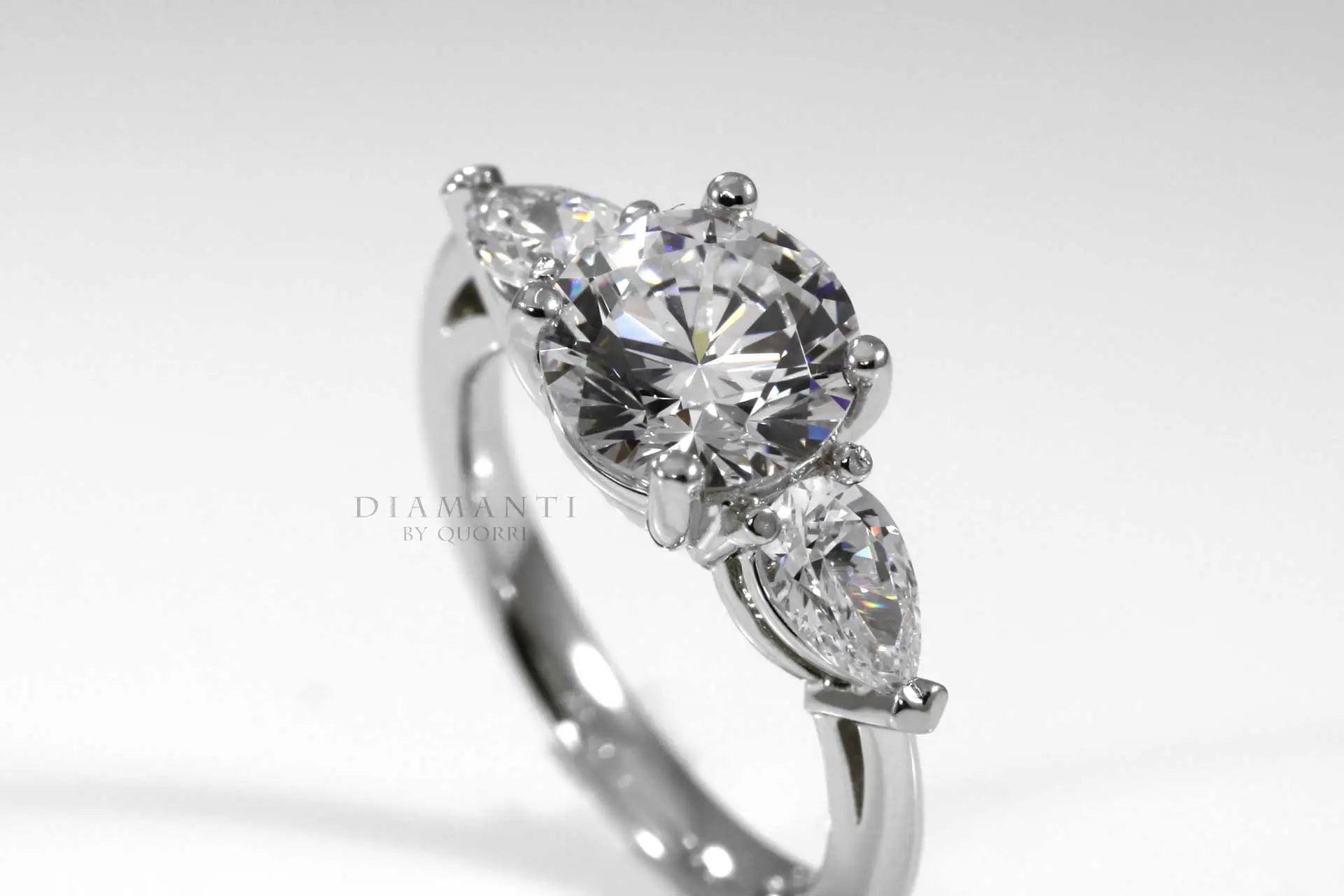 platinum 3 stone round and pear accented lab grown diamond engagement ring