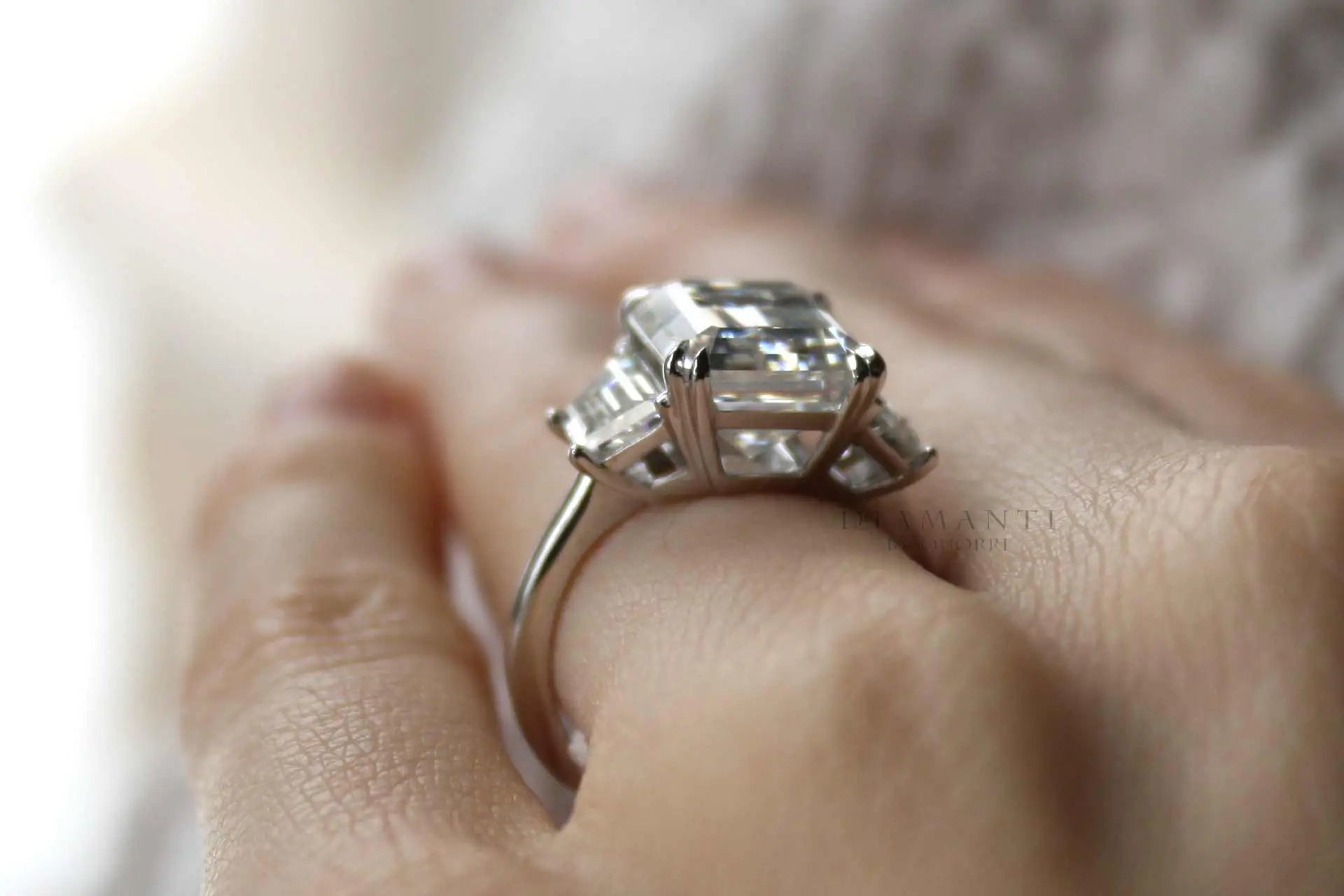 4 carat 18k white gold dual claw emerald and trapezoid three stone lab diamond engagement ring quorri