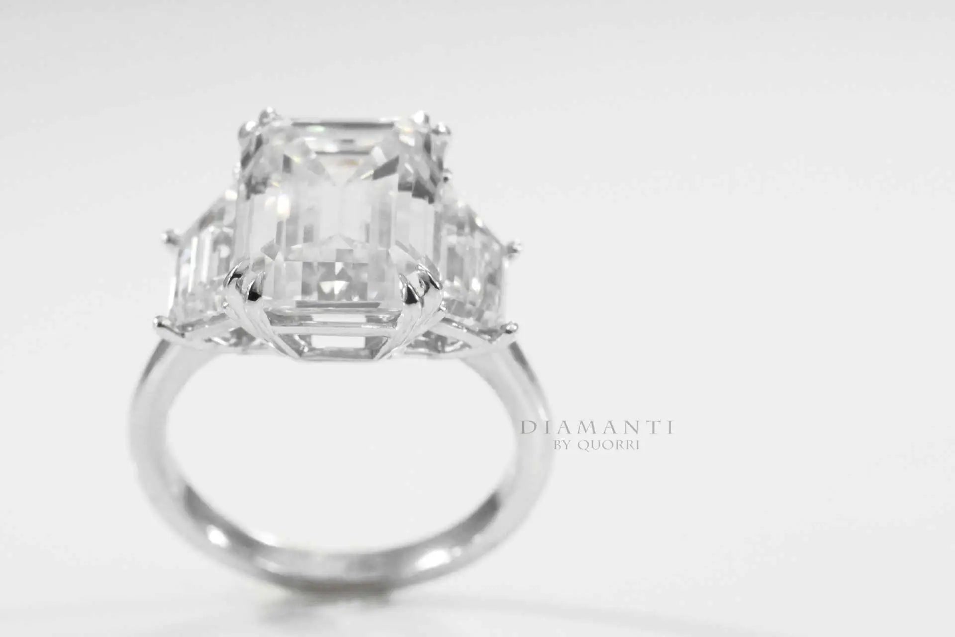 platinum dual claw 5 carat emerald and trapezoid three stone lab made diamond engagement ring quorri