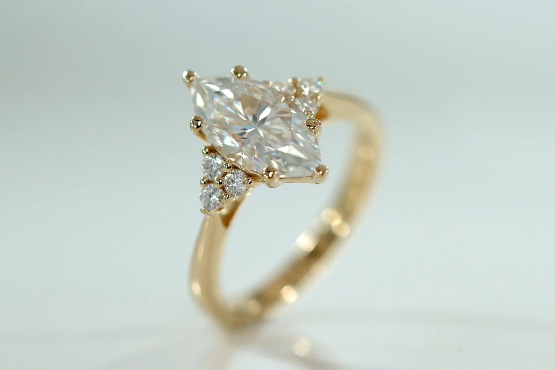 1k yellow gold 4 carat marquise and round accented lab created diamond engagement ring Quorri Canada