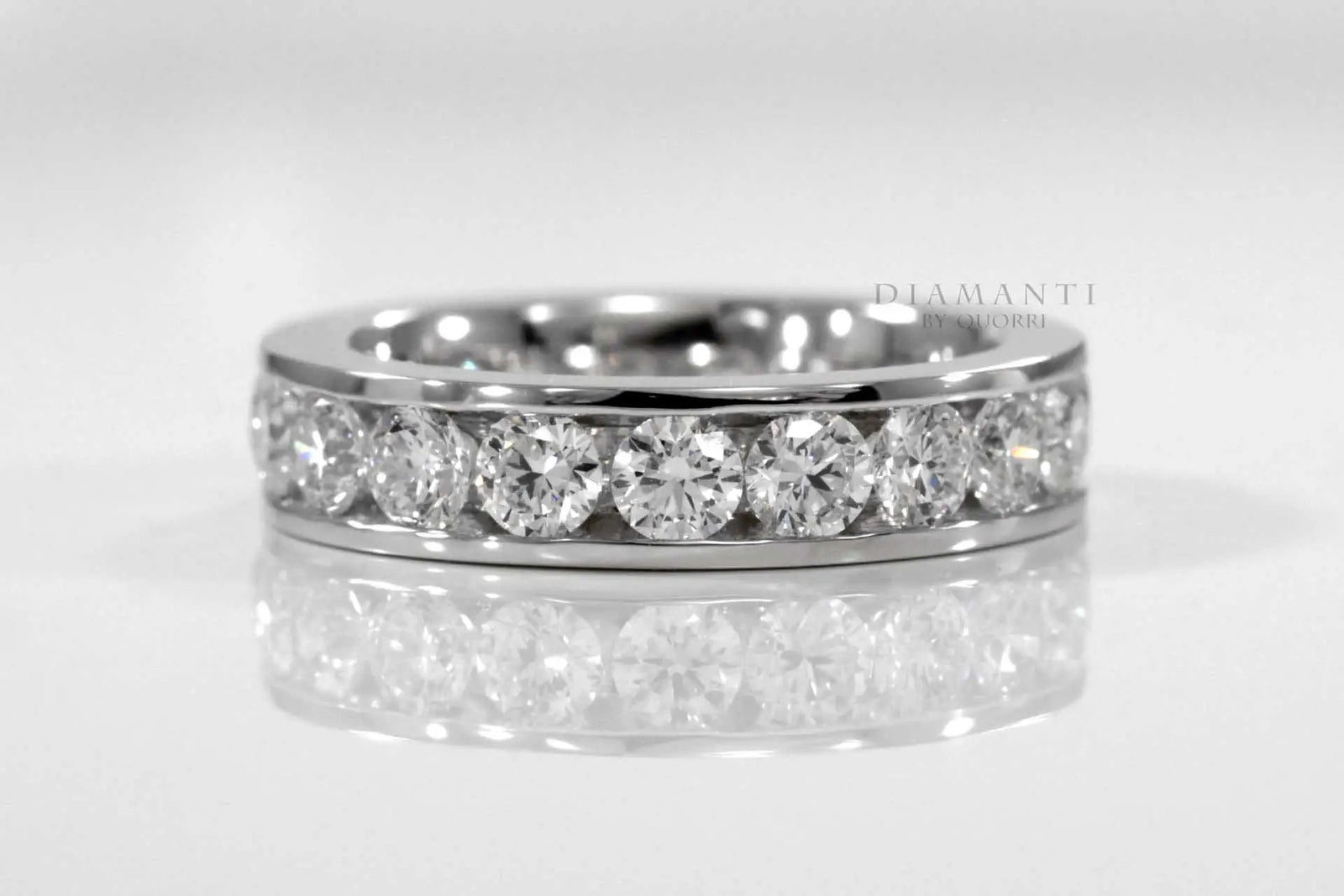 white gold designer round channel set eternity anniversary and wedding band Quorri