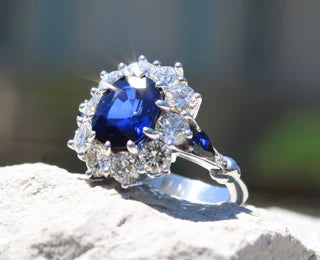 18k white gold halo oval lab grown blue sapphire and diamond engagement ring Quorri