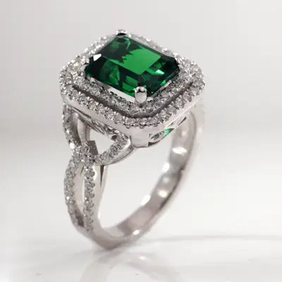 elaborate Zambian green emerald dual halo split band engagement ring