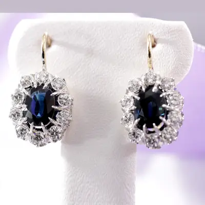 two-tone gold blue oval sapphire and white diamond drop earrings