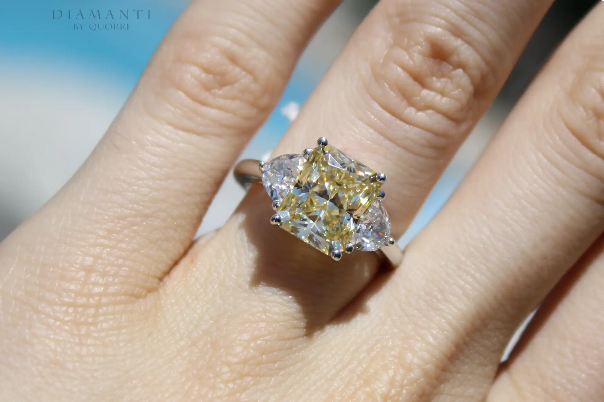 affordable designer three-stone 4.5 carat canarry yellow radiant and half moon lab grown diamond engagement ring Quorri Canada