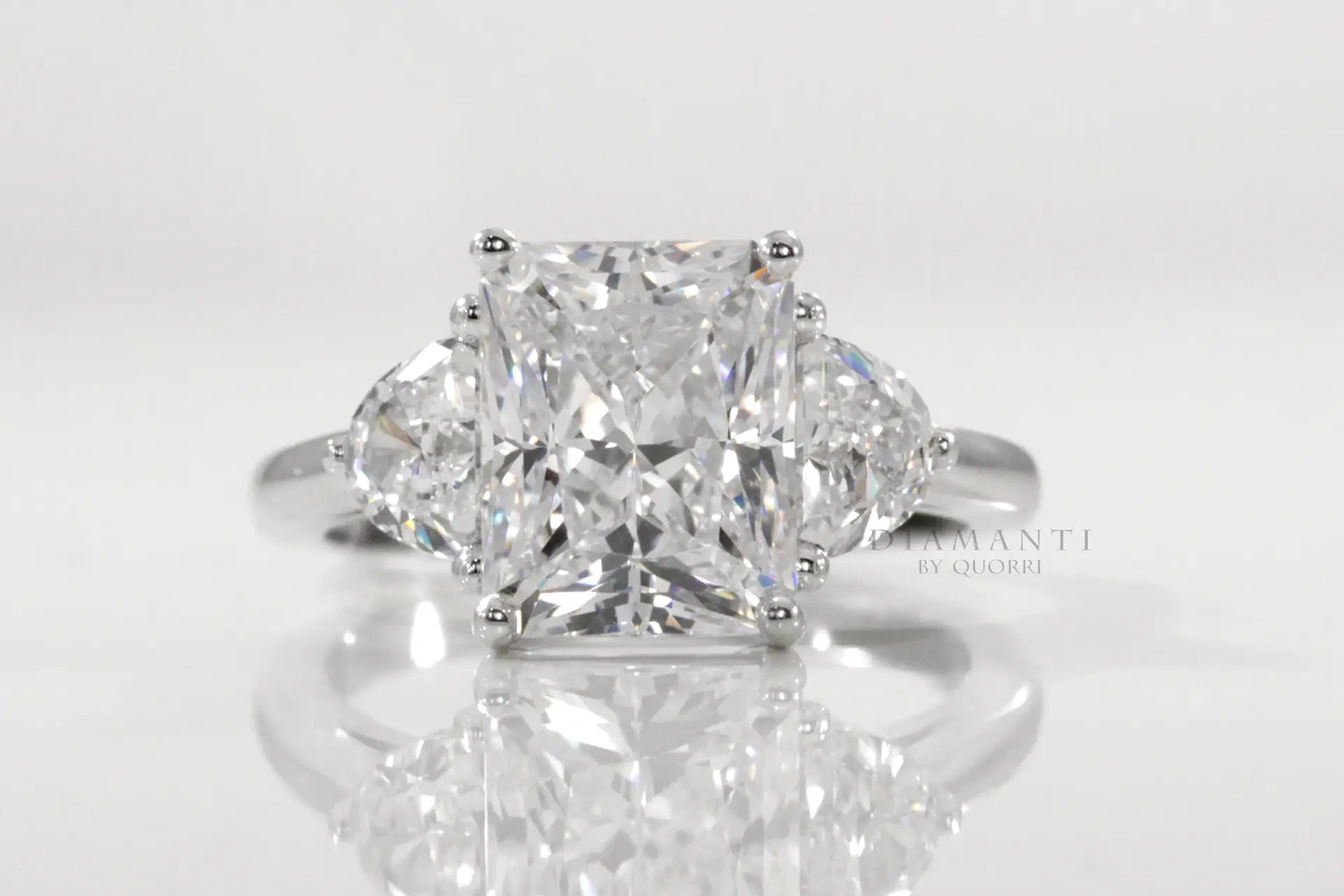 designer three-stone radiant and half moon lab diamond engagement ring Quorri
