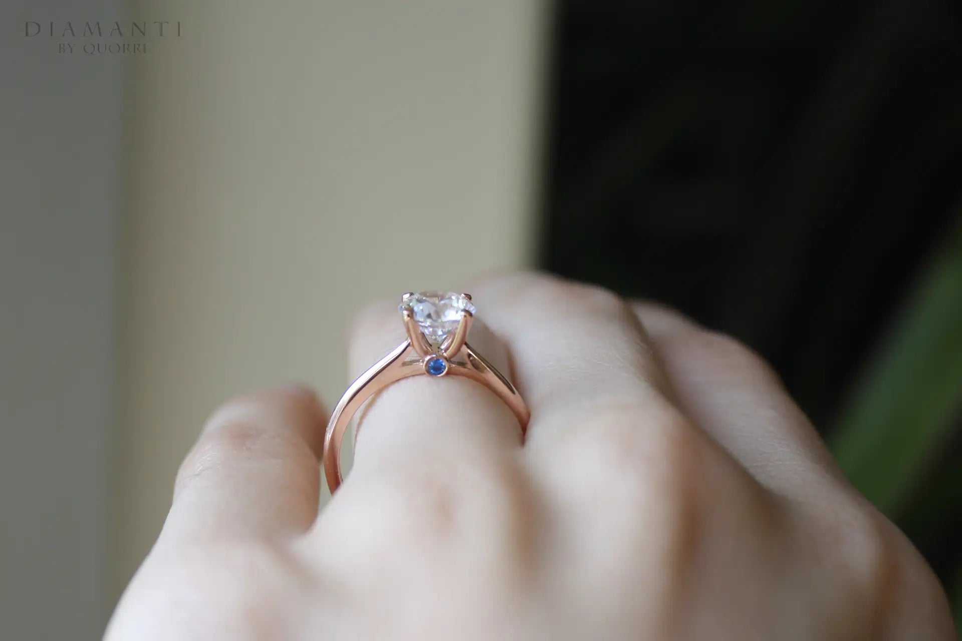 rose gold round lab grown diamond solitaire engagement ring with sapphire accent