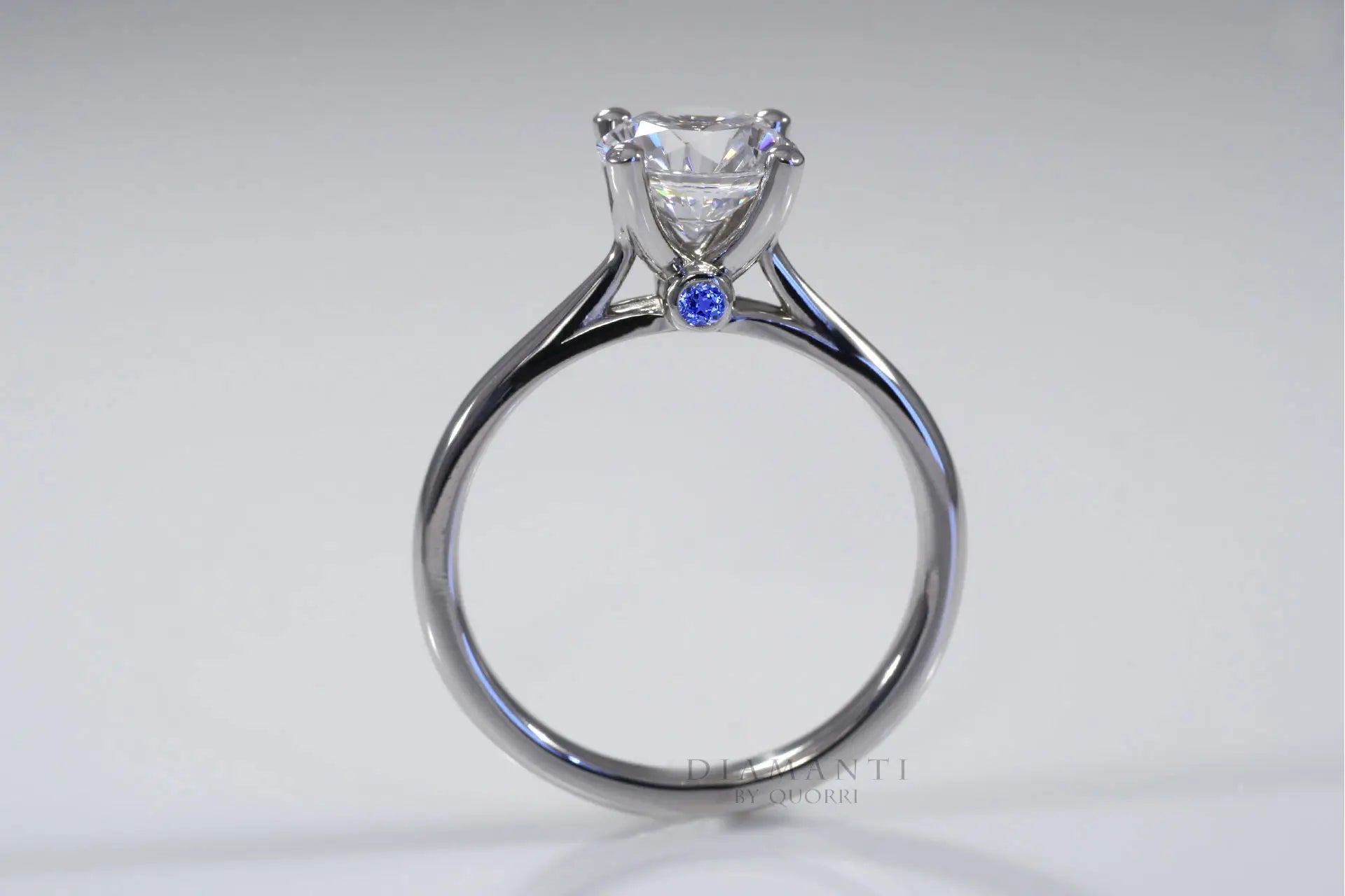 sapphire blue accented affordable round lab grown diamond solitaire engagement ring