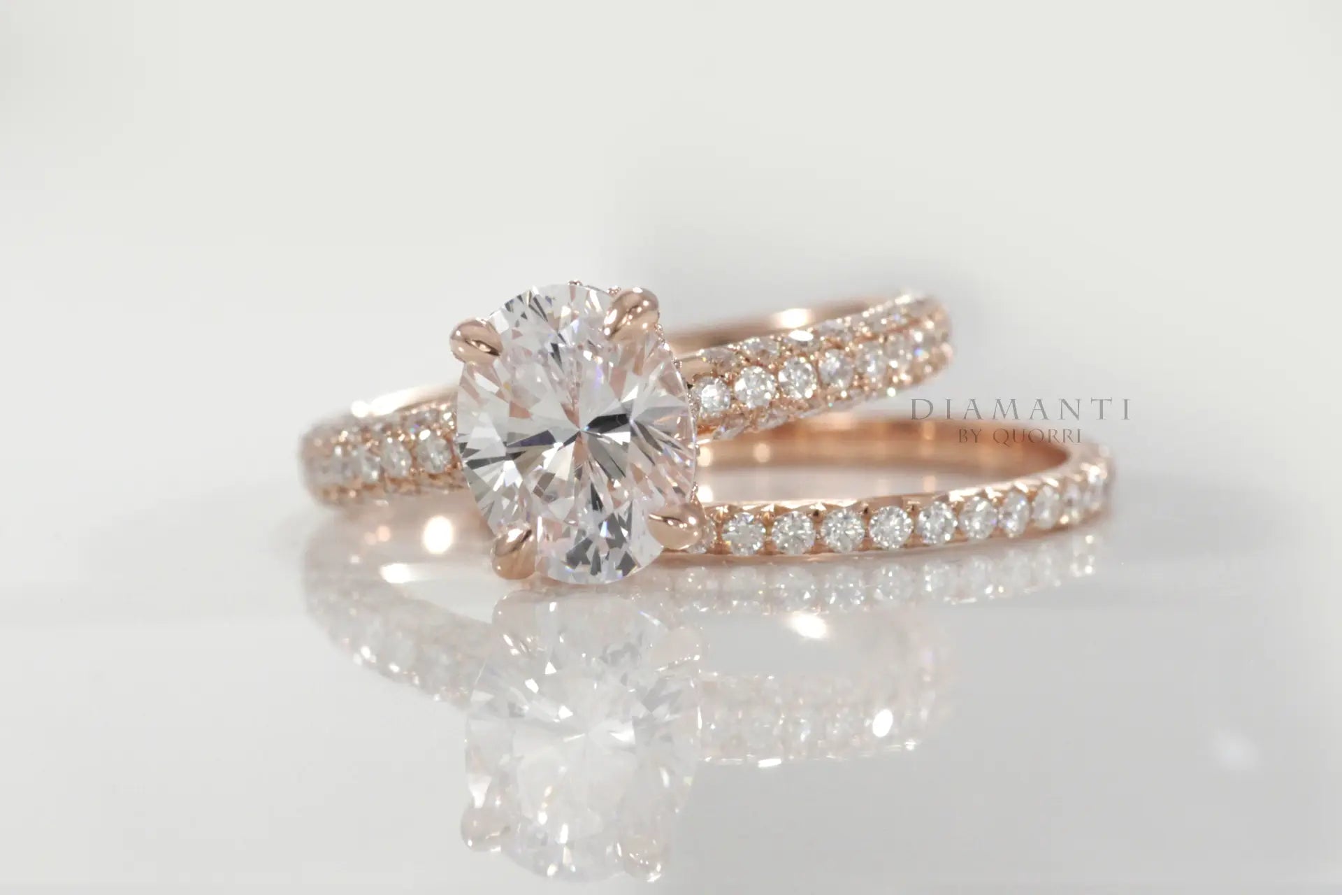 designer rose gold 3 carat oval lab diamond claw prong three sided band engagement ring set Quorri