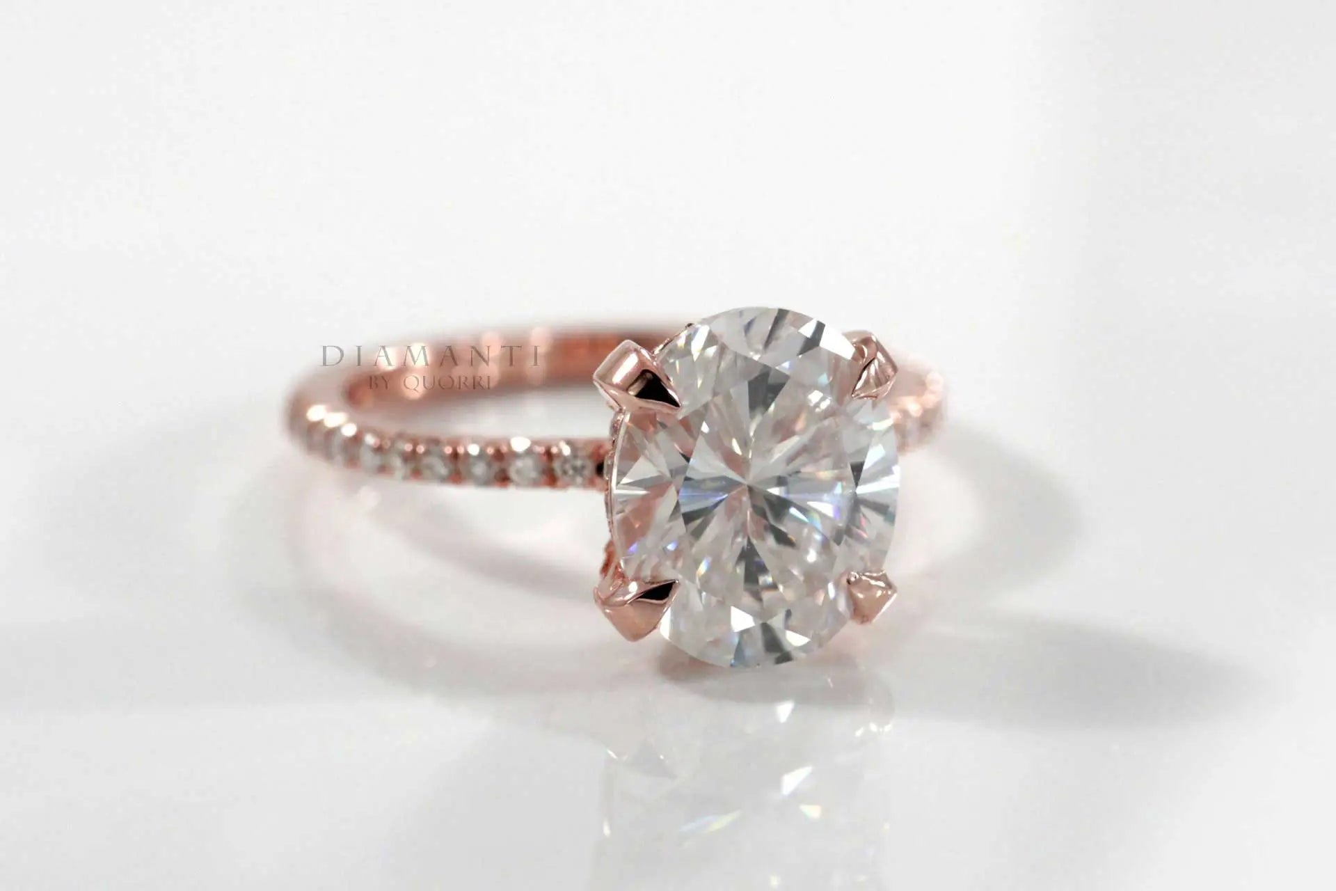 rose gold claw prong accented 2.5 carat oval lab created diamond engagement ring Quorri