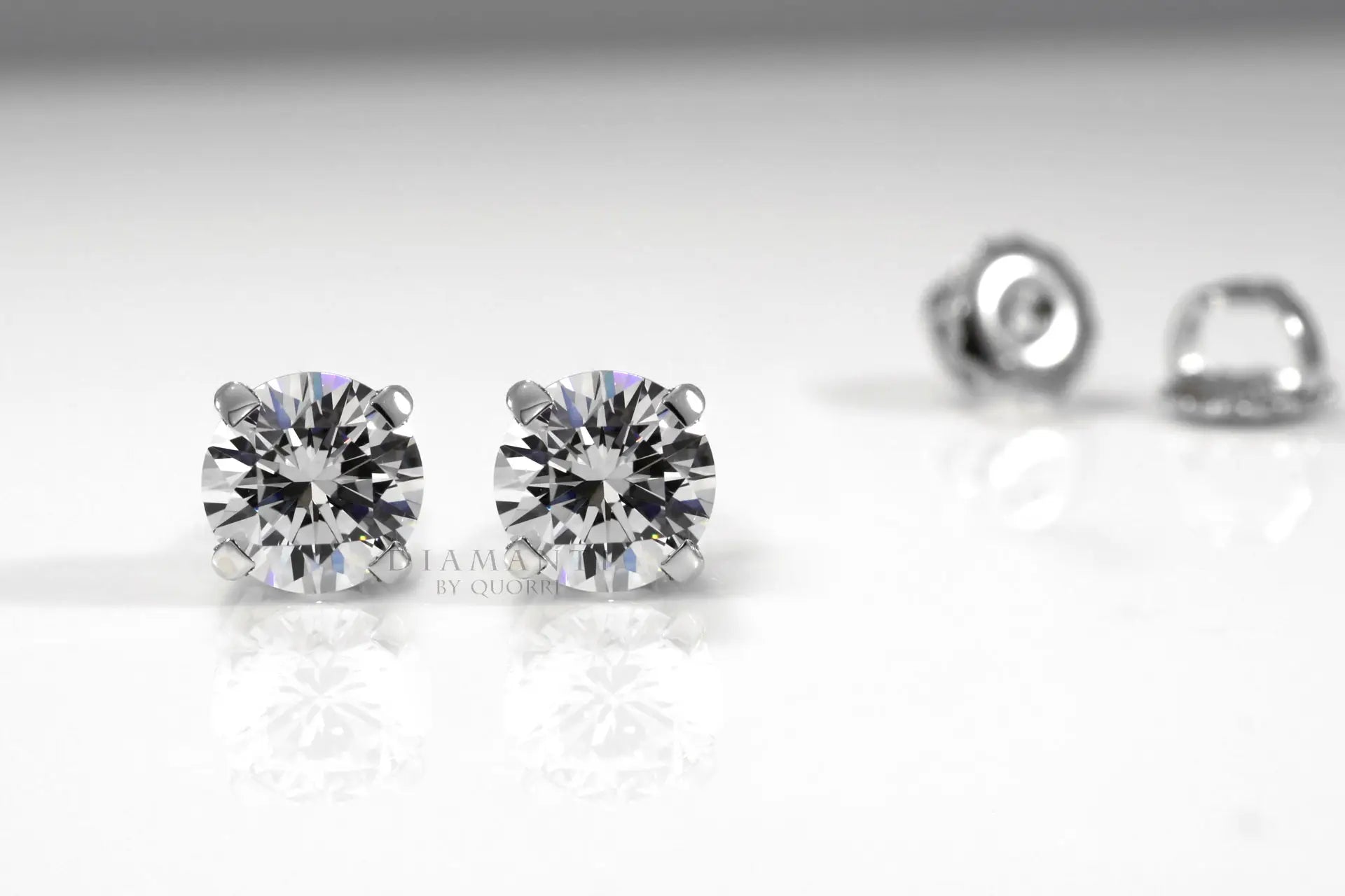 platinum and white gold round lab diamond screw-back stud earrings Quorri Canada