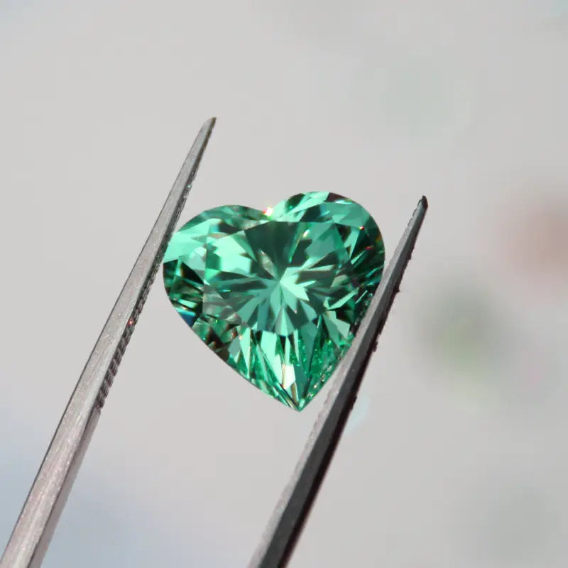 custom cultured green emerald heart cut at Quorri Canada