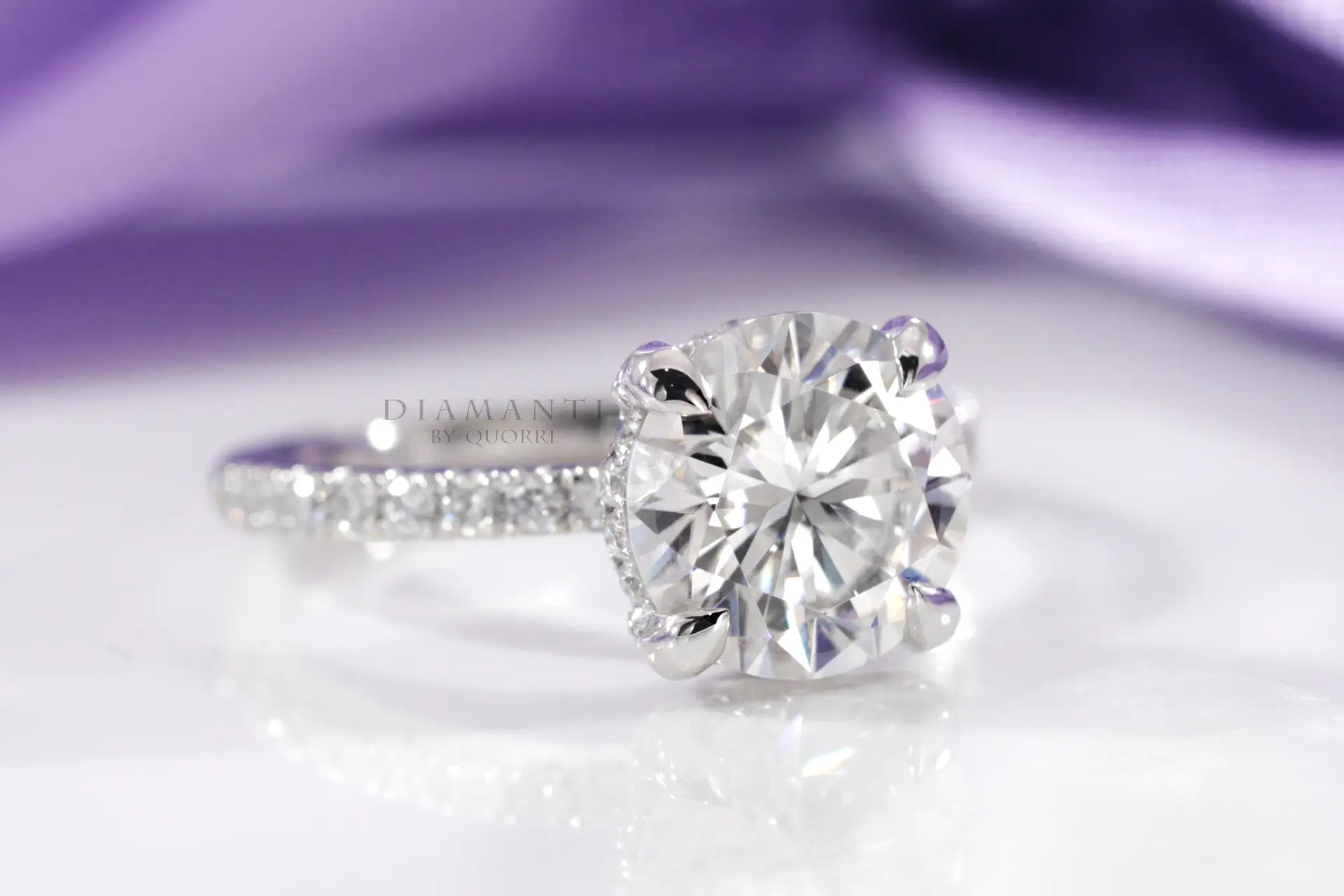 platinum accented claw prong and under-halo round lab diamond engagement ring