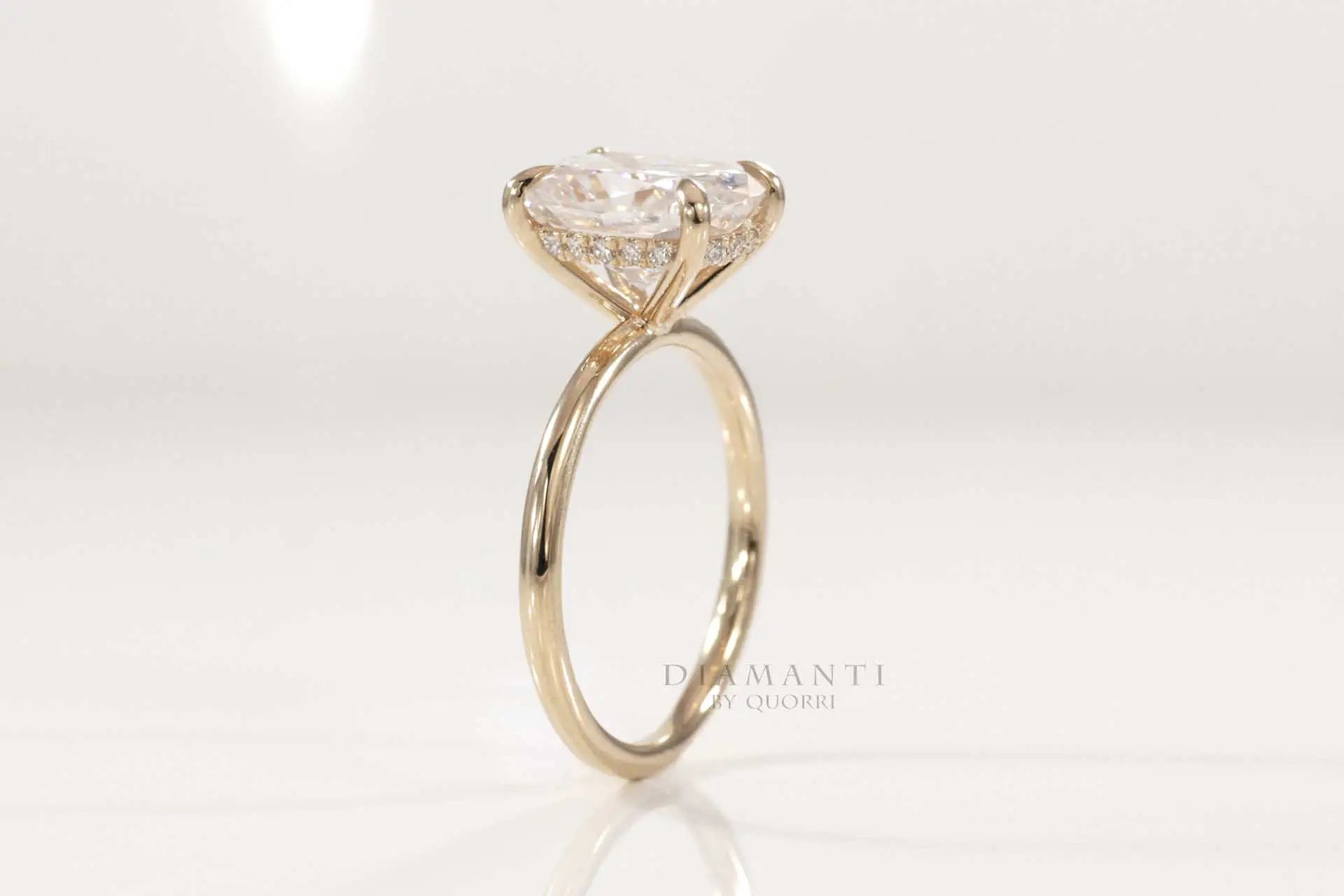 yellow gold claw prong under-halo elongated cushion lab diamond engagement ring Quorri 