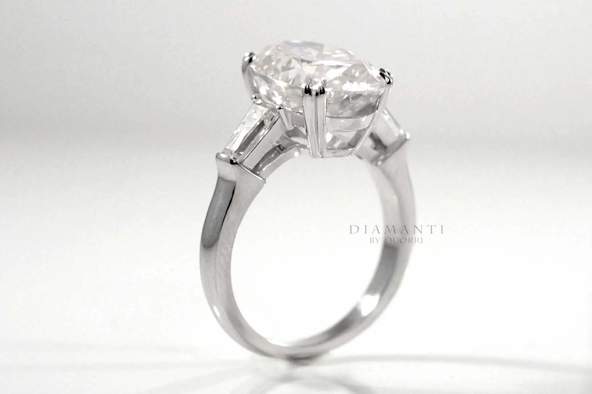 dual claw 3 carat oval three stone lab diamond engagement ring Quorri