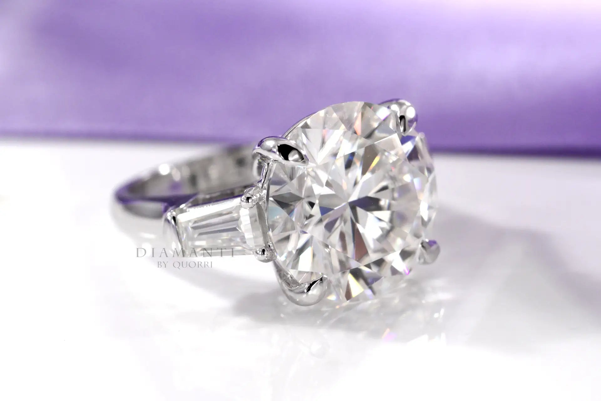 claw prong 5 carat round and baguette platinum three stone lab diamond engagement ring Quorri