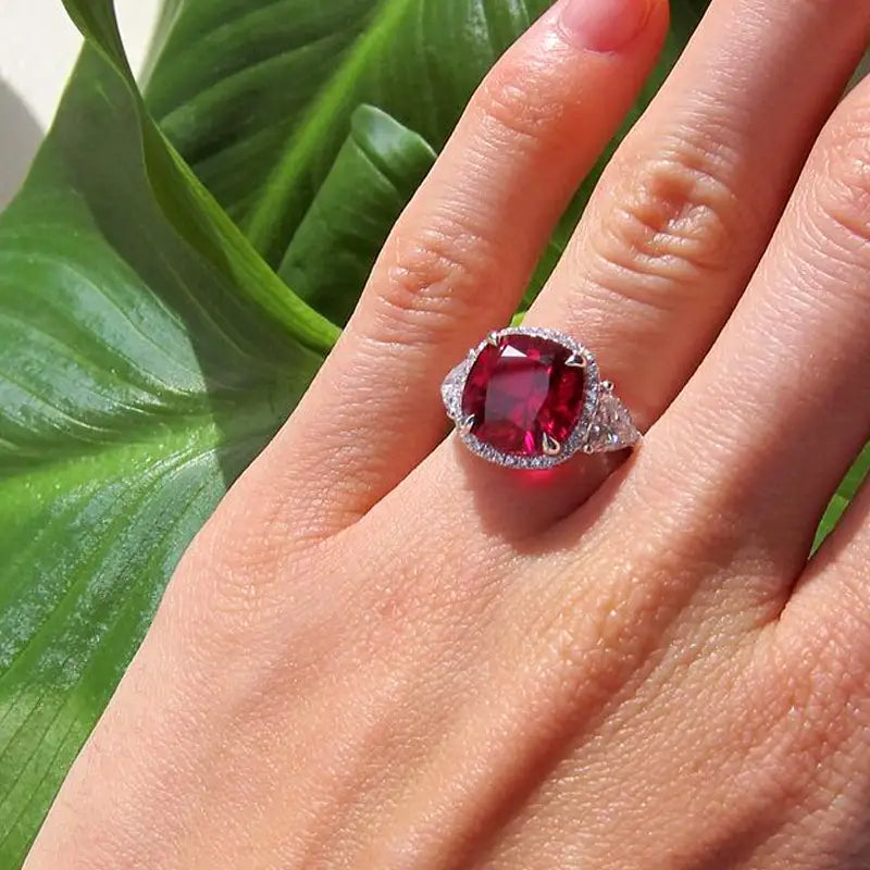claw prong cushion cut blood red lab grown ruby halo ring