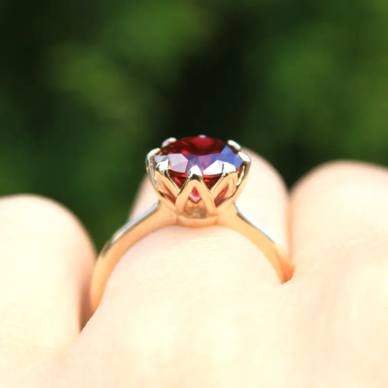 six prong round brilliant cut blood red cultured lab grown ruby ring