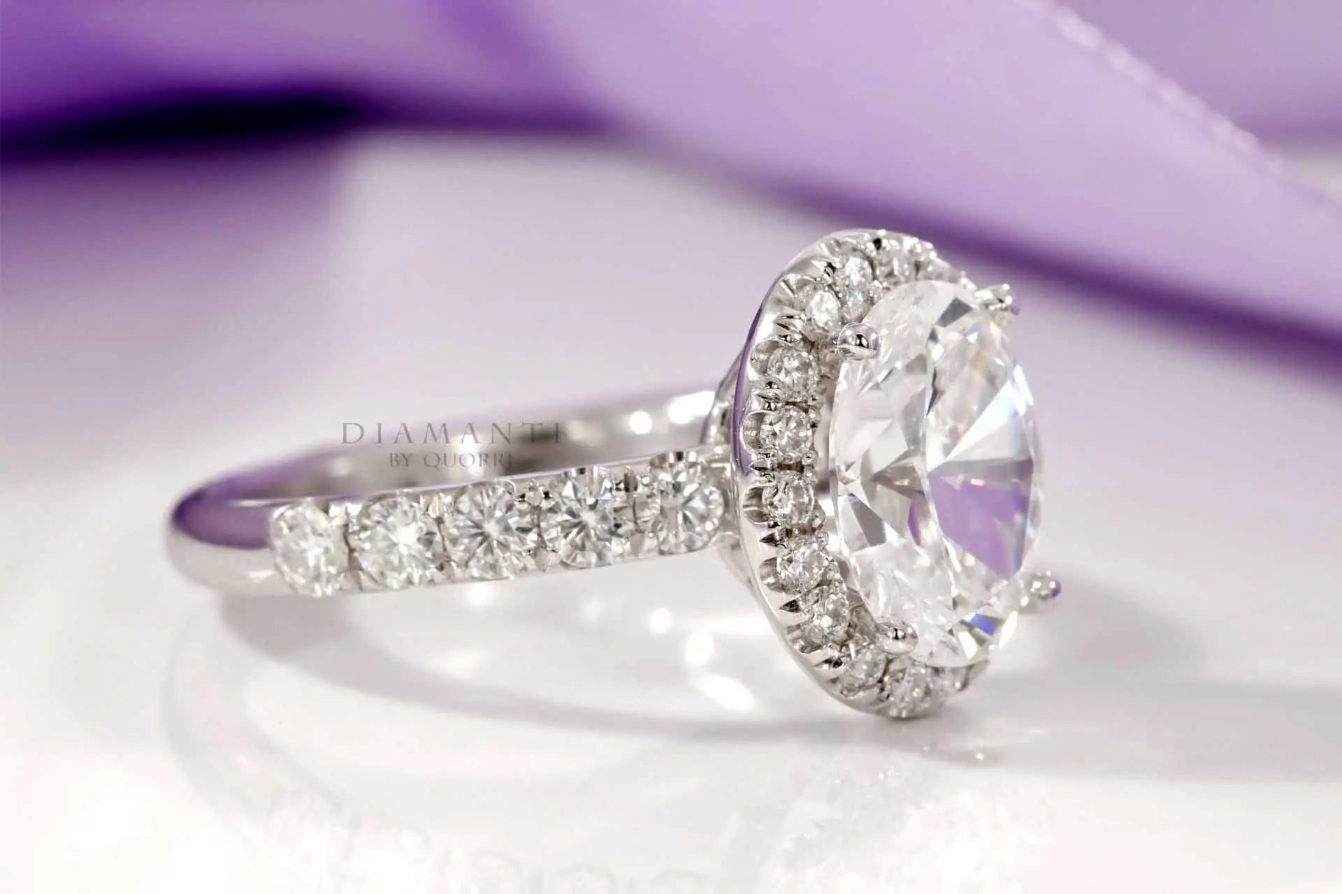 3 carat oval lab grown diamond halo accented engagement ring in solid 18k white gold at Quorri Canada