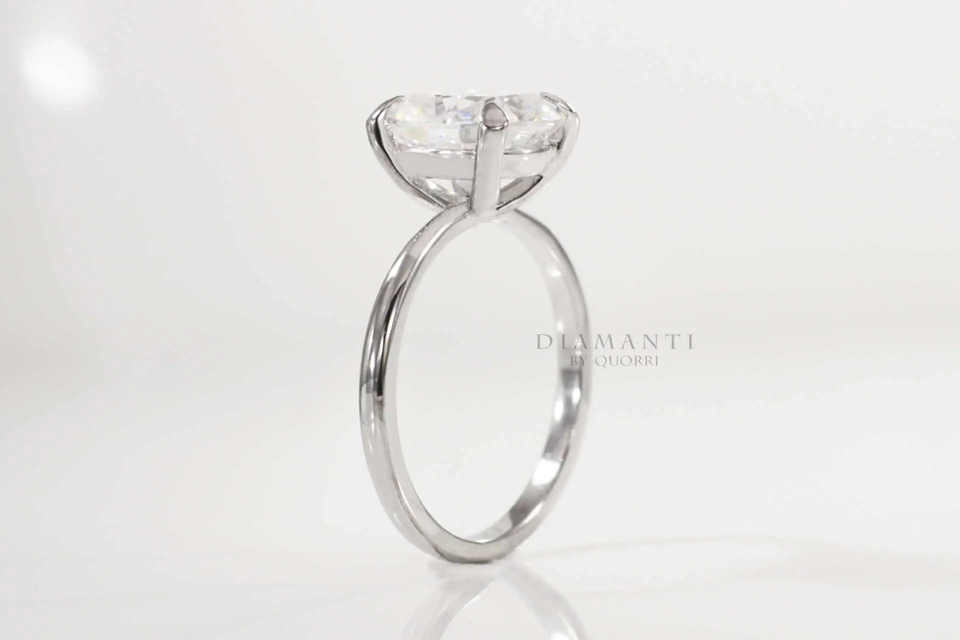 claw prong white gold elongated cushion lab diamond engagement ring Quorri