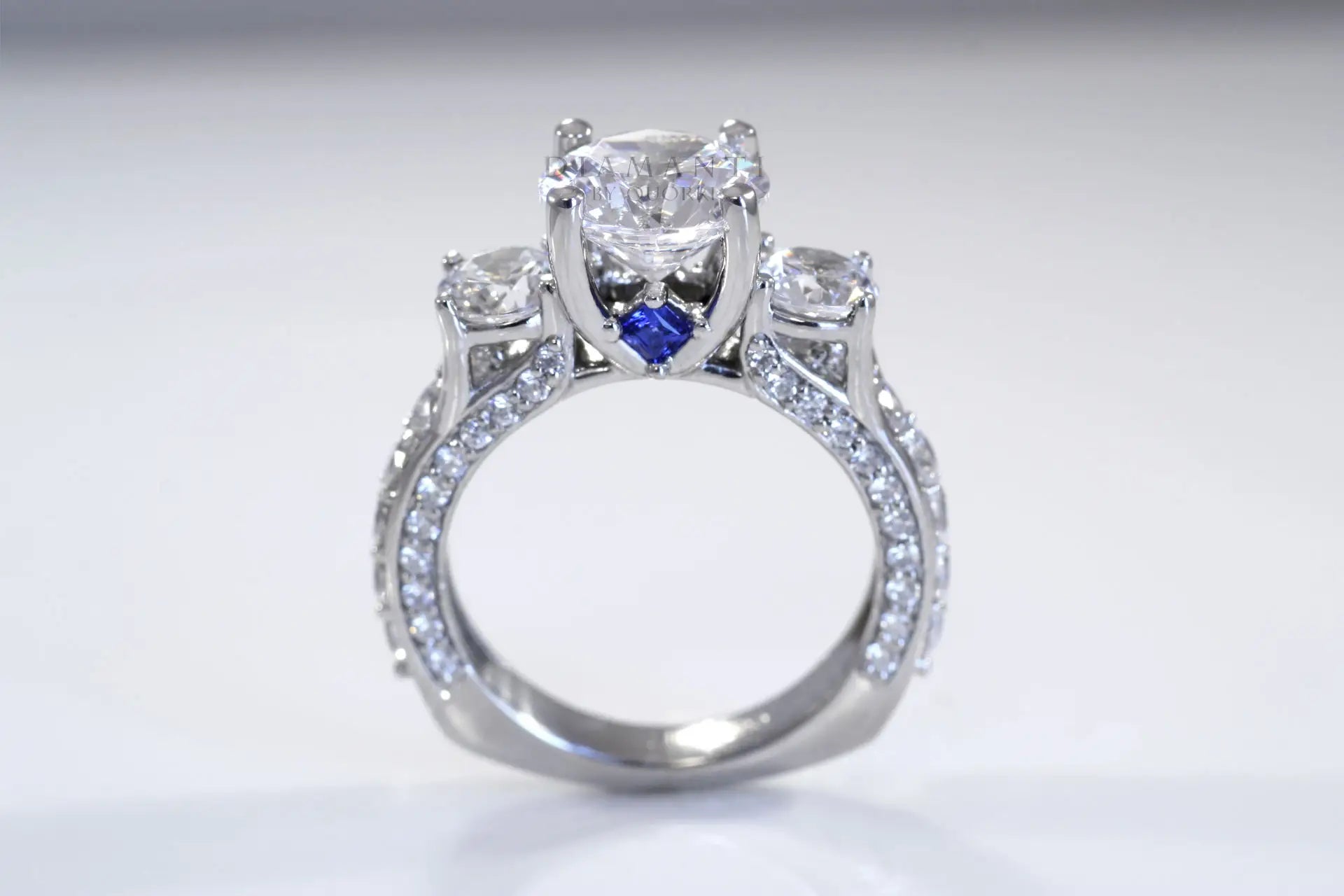 vera wang inspired sapphire accented 3 stone round lab diamond engagement ring Quorri