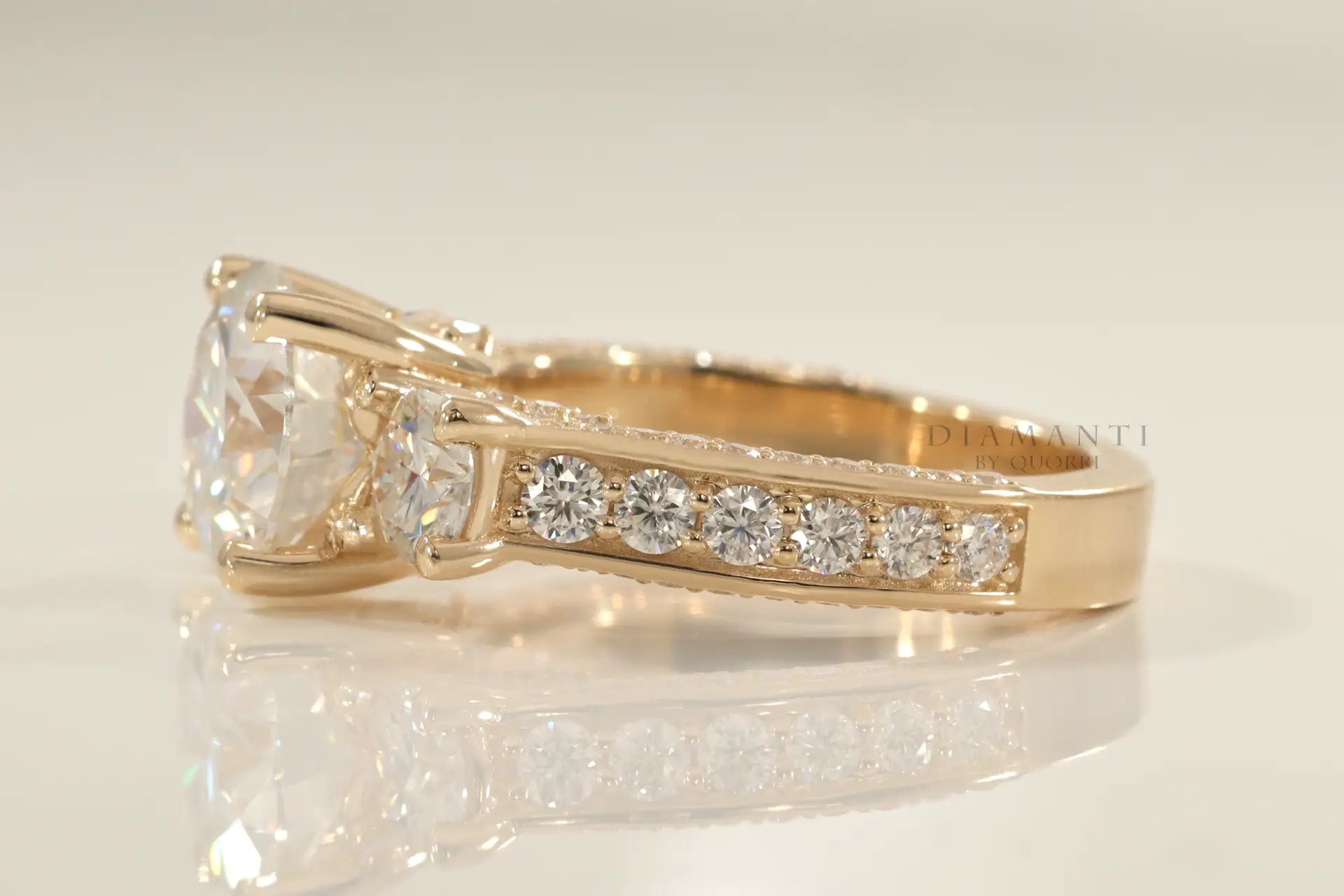 accented 18k yellow gold designer three stone 2 carat round lab diamond engagement ring Quorri
