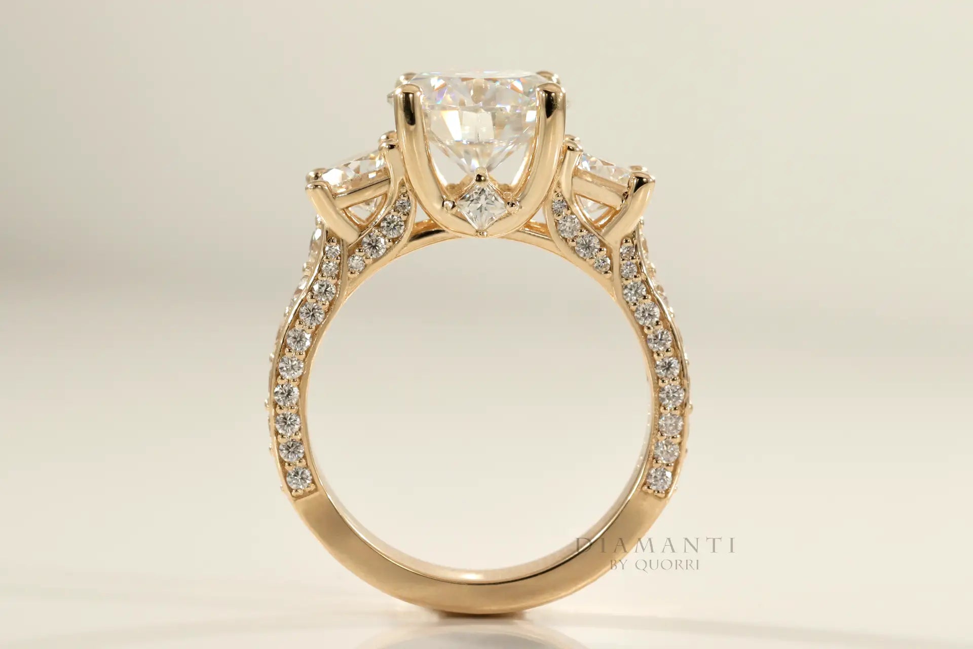 affordable accented 18k yellow gold designer three stone 2 carat round lab created diamond engagement ring Quorri
