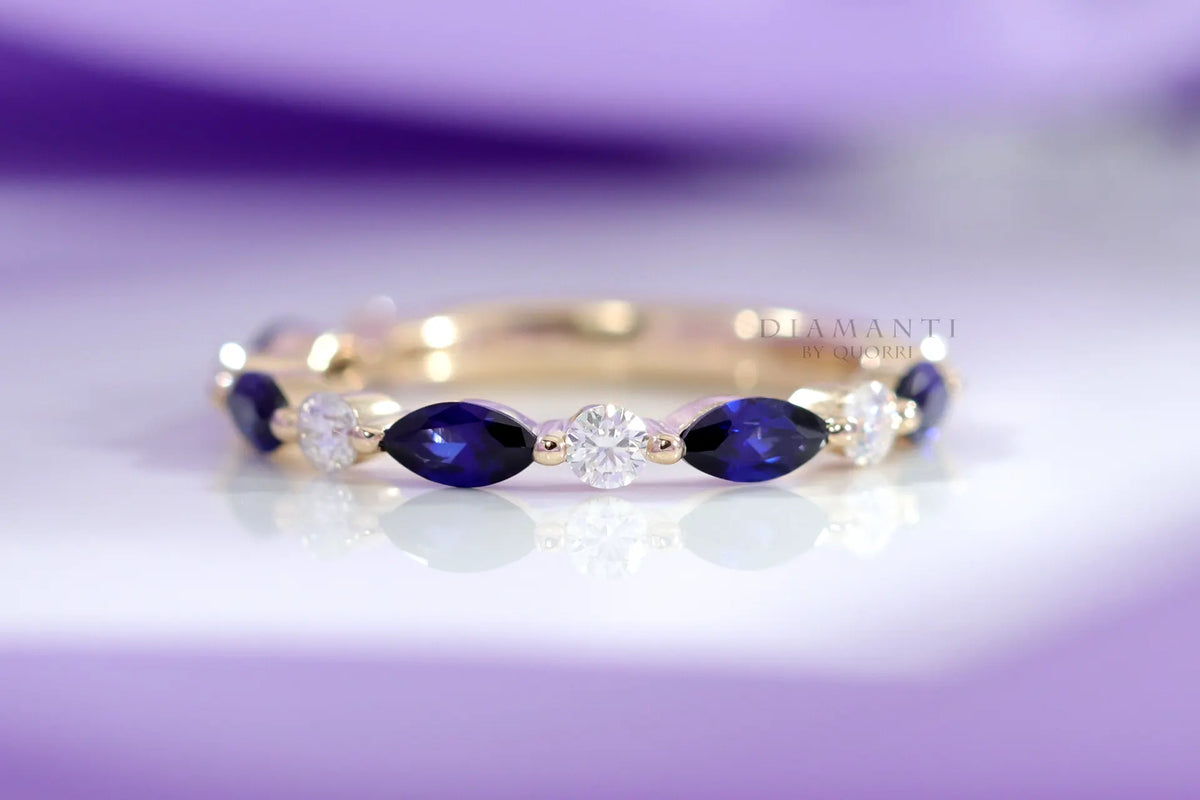 designer yellow gold alternating white diamond and blue sapphire wedding band Quorri