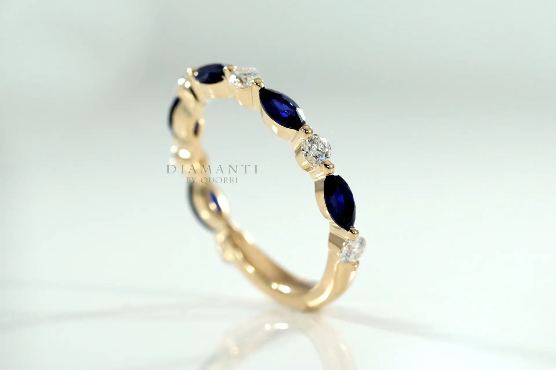 designer 14k yellow gold alternating white grown diamond and blue grown sapphire wedding band Quorri