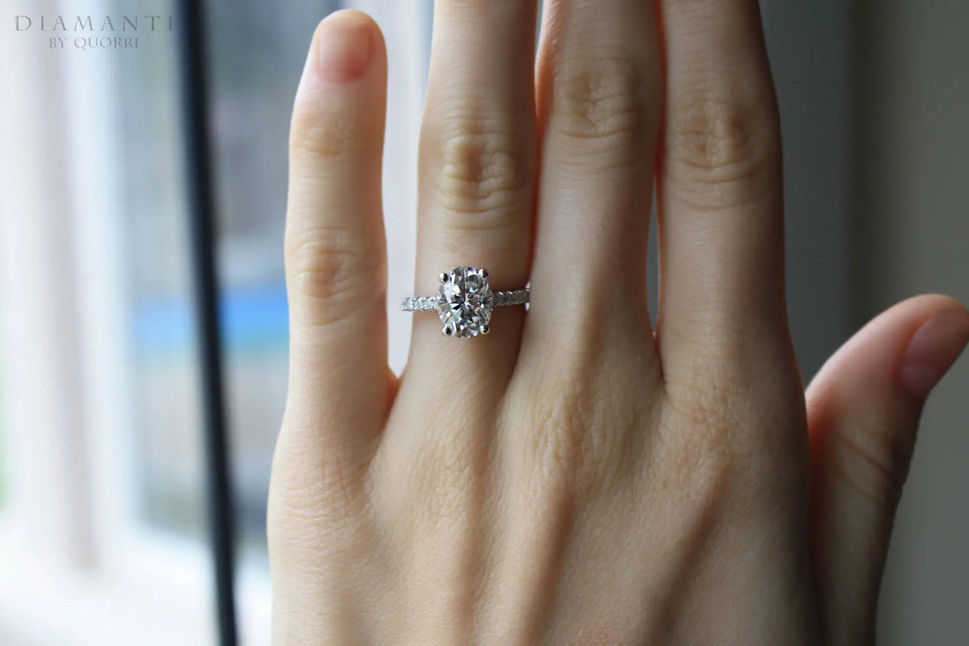 designer 18k white gold accented oval lab made diamond engagement ring Quorri