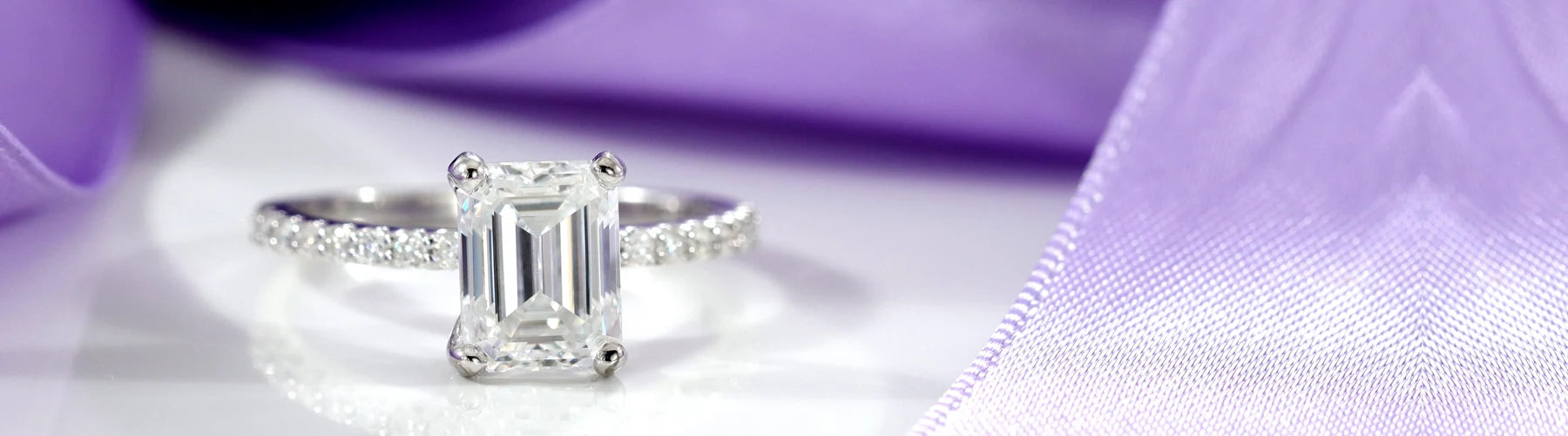emerald cut accented lab diamond engagement ring in 18k white gold Quorri