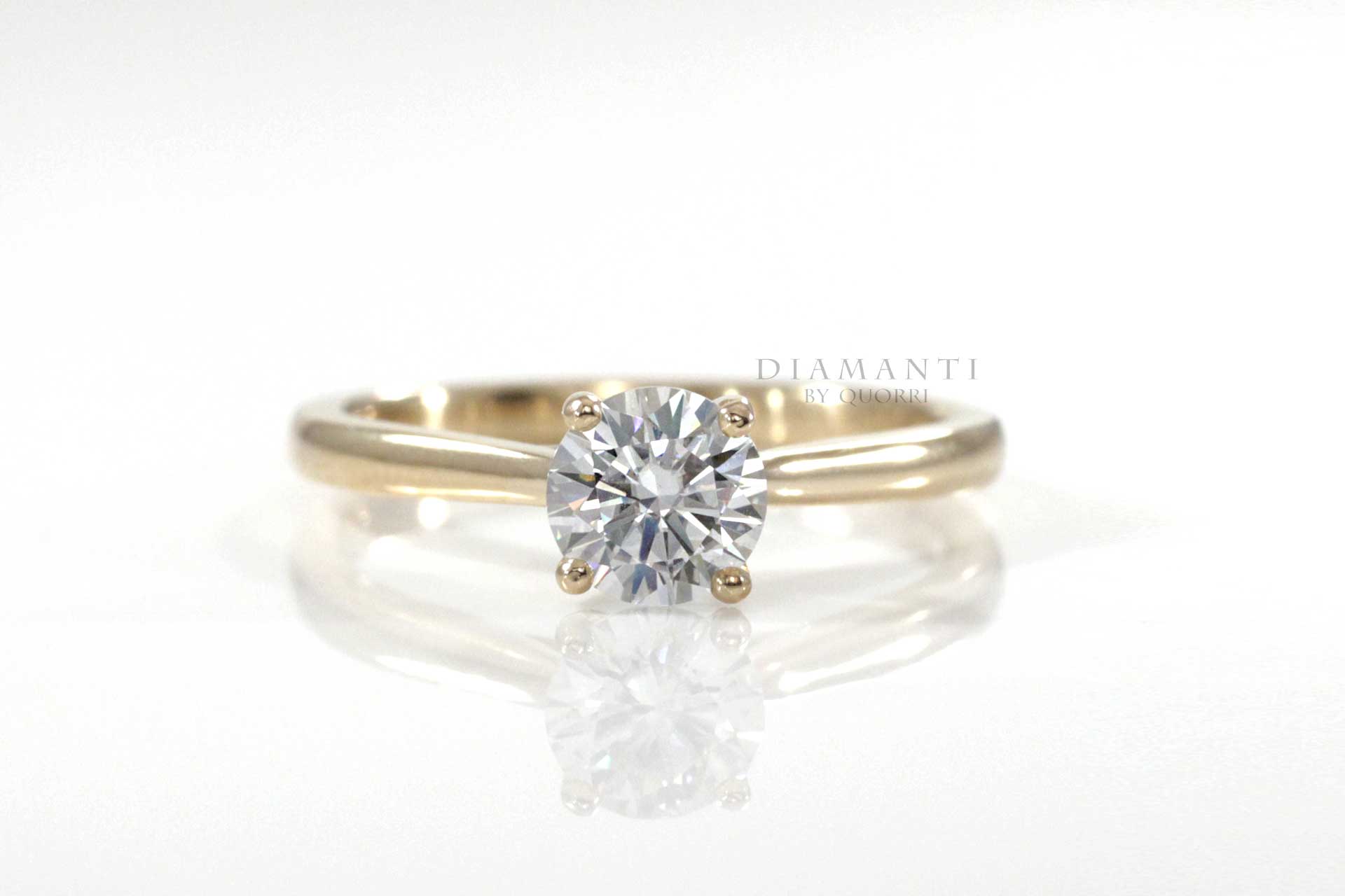 petite diamond solitaire ring in yellow gold made in canada